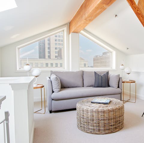 Mix your favourite cocktail and admire the city views from the comfy sofa