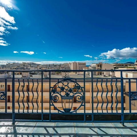 Take in the views over the city from the private balcony