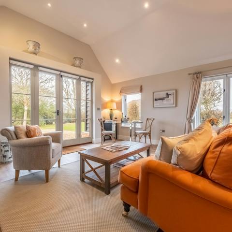 Find a cosy spot to read, relax and admire the garden views