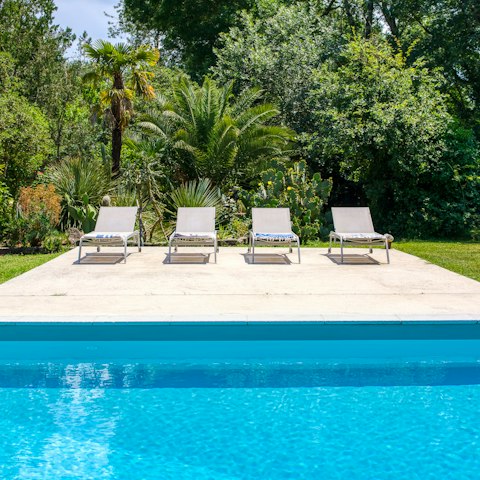 Bask in the warm sunshine next to the crystal clear pool