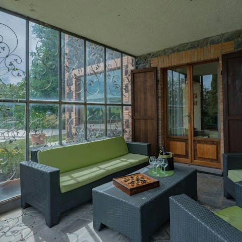 Relax in the conservatory with a glass of wine