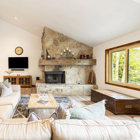 Enjoy a good book next to the cosy fireplace in the living room