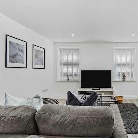 Kick back on the plump sofa after a busy day of touring the city