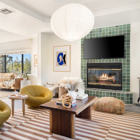 Cosy up beside one of the fires in the stylish living room