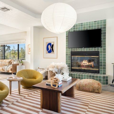 Cosy up beside one of the fires in the stylish living room
