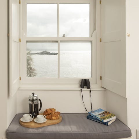 Eat breakfast on the window seat, looking out at the sea