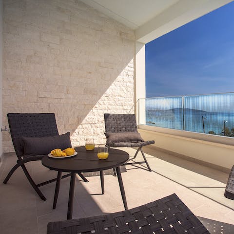 Sip your morning cuppa on the balcony as the sky comes alive and the sea sparkles before you