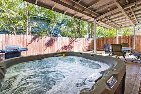 Bubble away under string lights in the covered Jacuzzi
