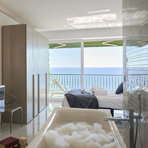 Enjoy long soaks in the bath overlooking the sea