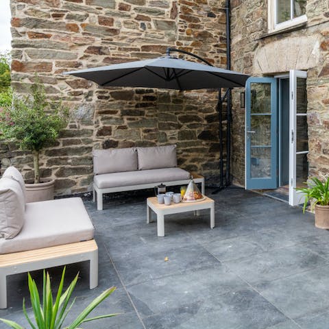 Watch the world go by from the peaceful stone patio with dinner on the barbecue sizzling away