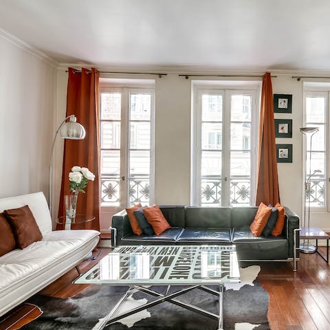 Recline on the soft leather couch with a glass of champagne
