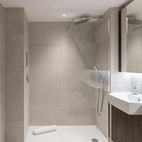 Enjoy a post-yoga rainfall shower in the luxurious bathroom