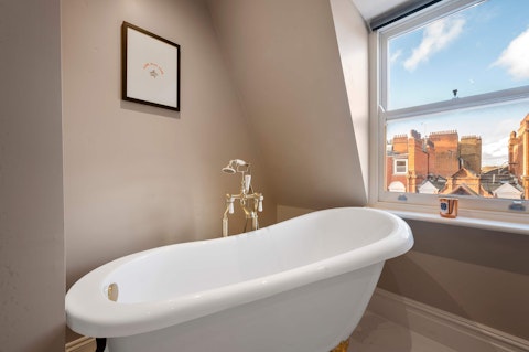 Soak in the clawfoot tub with rooftop views over Chelsea