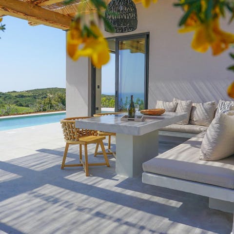 Tuck into an array of Greek bites at the alfresco dining table