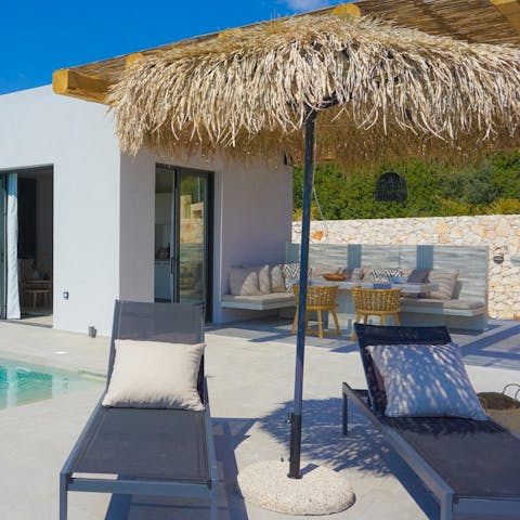 Get stuck into your holiday read under the shade of the parasol