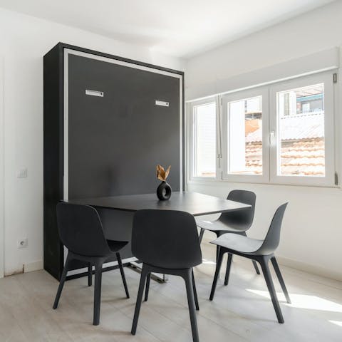 Lift up the Murphy bed during the day and have space to get some work done