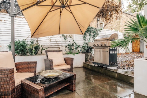 Step outside to a walled garden terrace for a barbecue