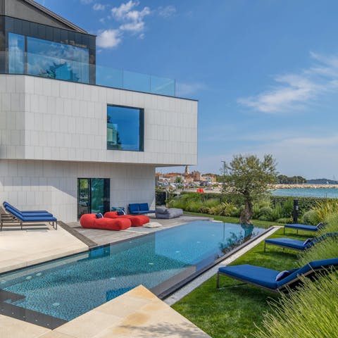 Swim in the private pool with a view of the ocean