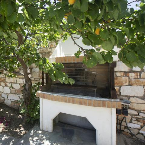 Tend to the sizzling barbecue as your loved ones relax in the shade