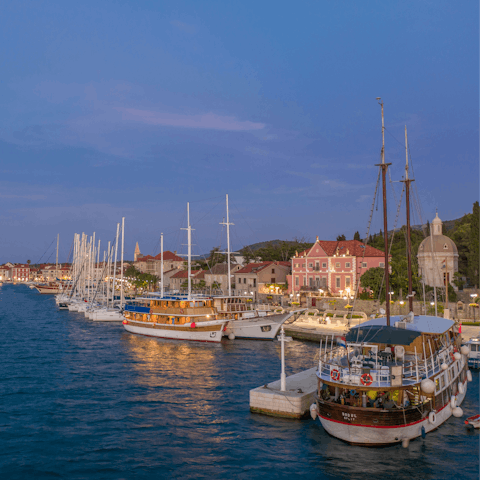 Take a half hour walk or drive five minutes west to the town of Stari Grad