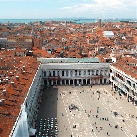 Visit the iconic San Marco square and enjoy a cold drink while people watching