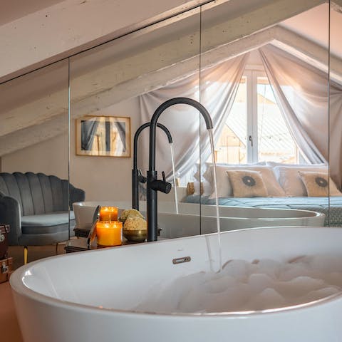 Take a soak in the luxurious bathtub as you unwind after a day in the city