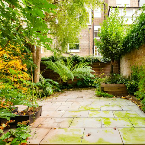 Relax in the lushly planted private courtyard with a gin and tonic