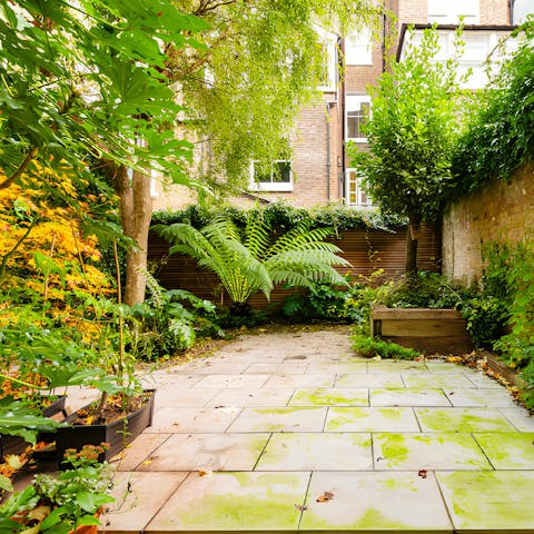 Relax in the lushly planted private courtyard with a gin and tonic