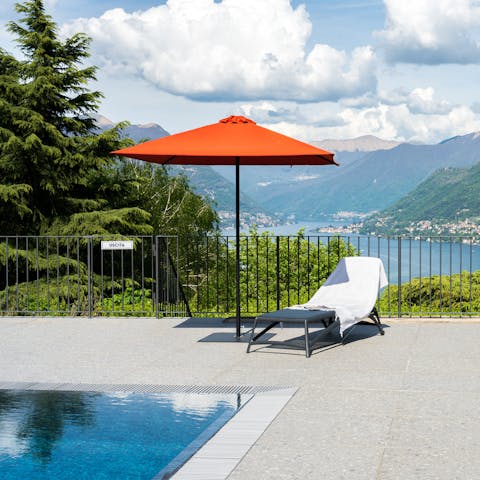 Lounge by the shared pool with lake views