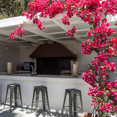 Enjoy a drink in the outdoor bar