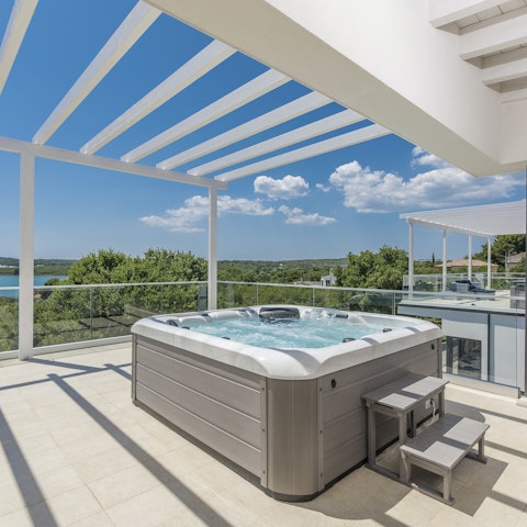 Toast the sunset from the hot tub