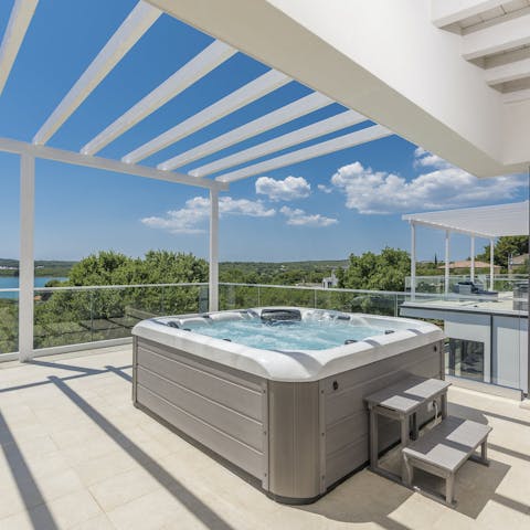 Toast the sunset from the hot tub