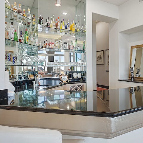 Test your mixology skills at the bar