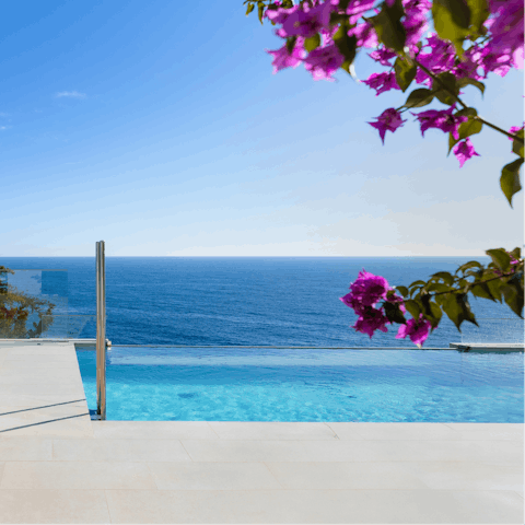 Enjoy sea views while floating in the swimming pool