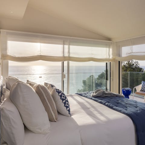 Wake up in the main bedroom to the waves crashing on the shore