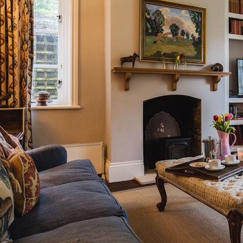 Gather round the ornate fireplace for a cosy evening in