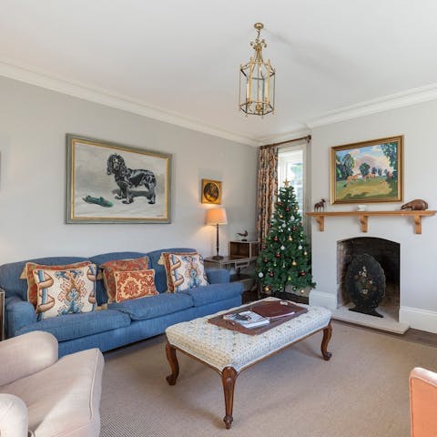 Gather round the ornate fireplace for a cosy evening in