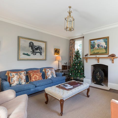 Gather round the ornate fireplace for a cosy evening in