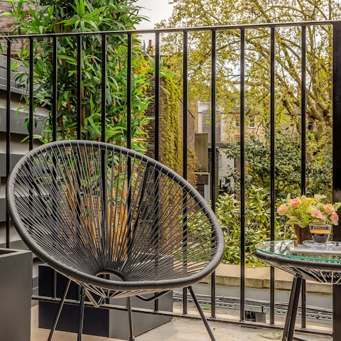 Admire the views on the leafy balcony