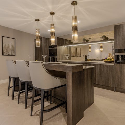 Sip wine while cooking in the elegant kitchen