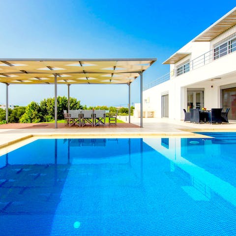 Glide through silky waters in your spacious swimming pool