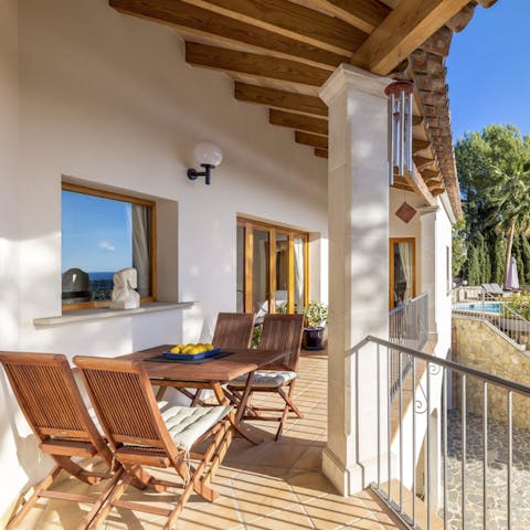 Dine on delicious tapas dishes with a glass of Cava on the balcony