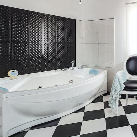 Relax and unwind in the luxurious hot tub
