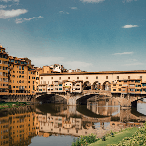 Admire the medieval Ponte Vecchio, a short stroll away