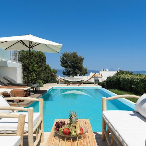 Spend hot afternoons tanning on a day bed or swimming in your private pool
