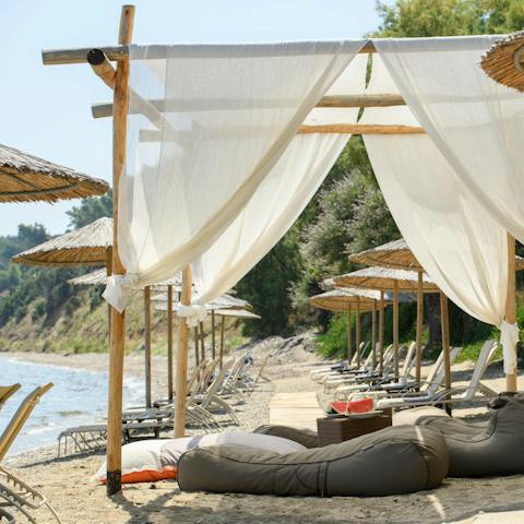 Take advantage of your private beach section with reserved sun loungers and umbrellas