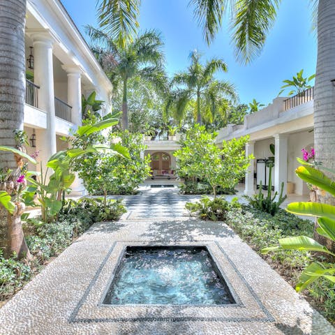 Wander about the villa's tropical gardens and find a quiet spot to read
