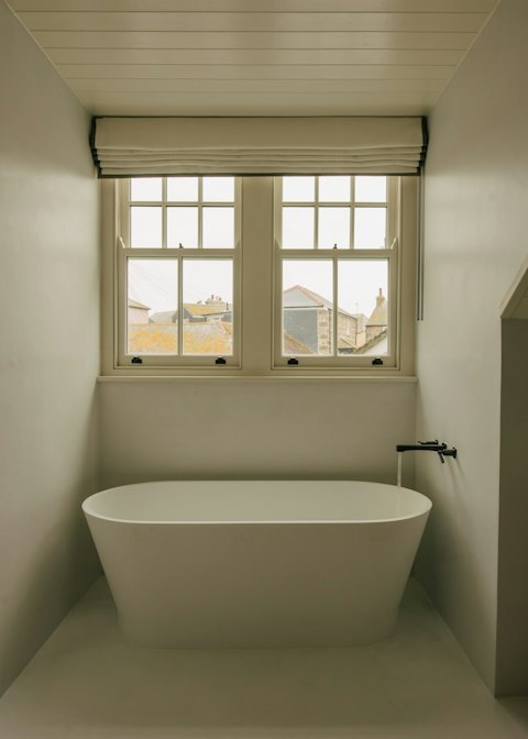 Sink into the freestanding tub for a soak after a morning surf