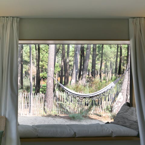 Swing in the hammock surrounded by an abundance of nature 