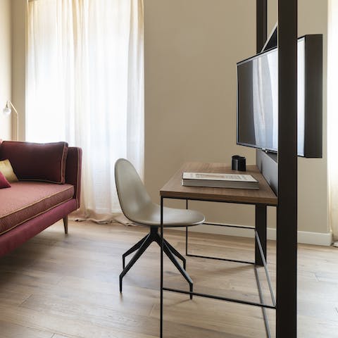 Hit send on those last emails from the bedroo's desk space